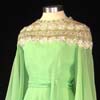 green gown with lace shoulders